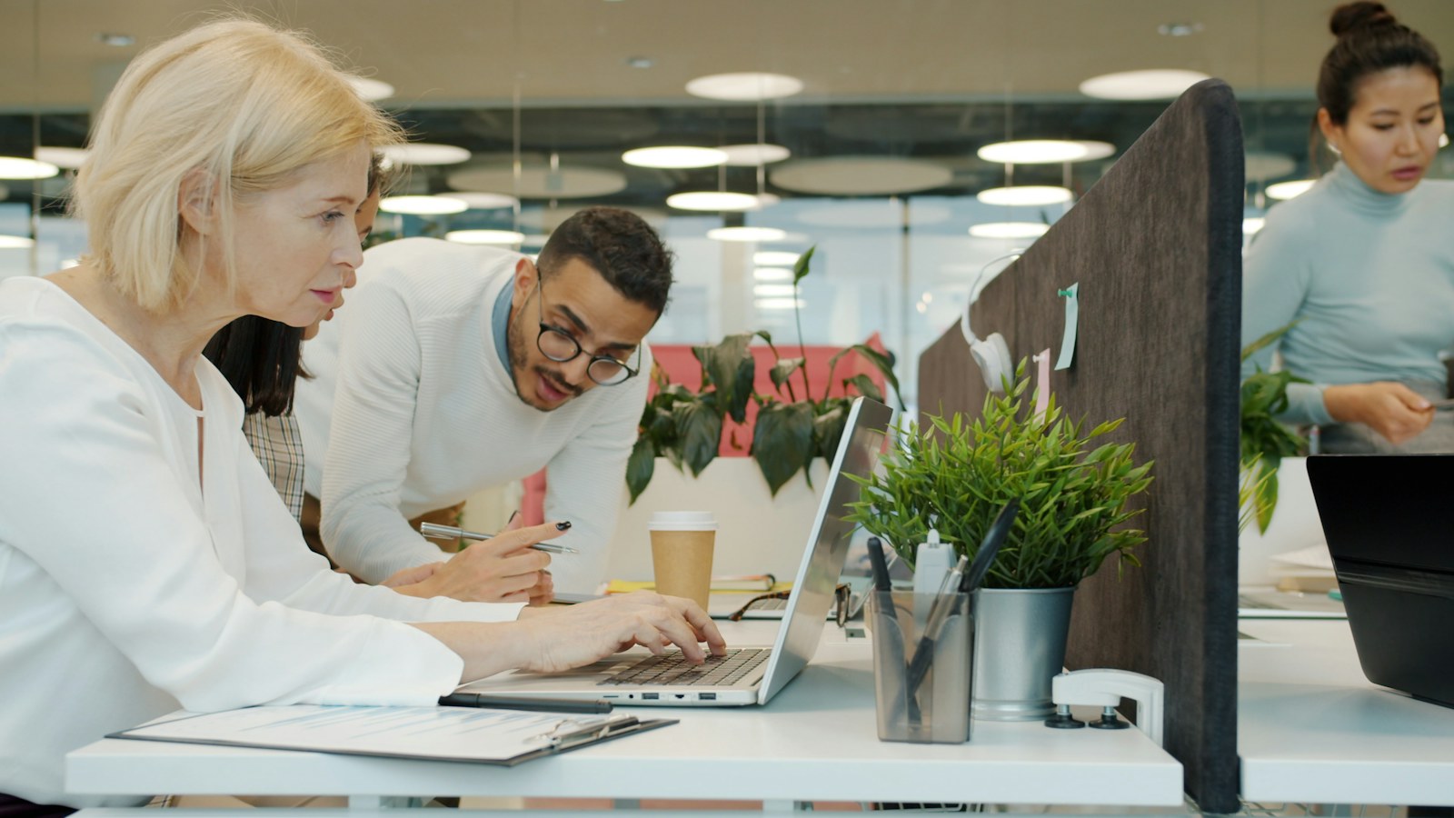 Creative team collaborating around a studio table